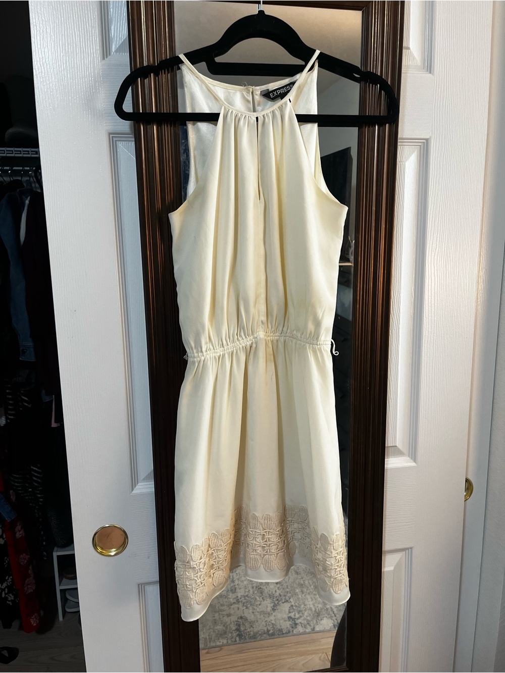 Cream Express dress with lace trim at the hem
